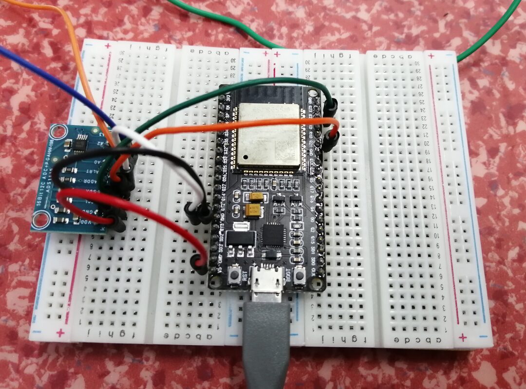 Exploring the Relationship Between Maximum Induced Current and Magnet Drop Height Using Phyphox, ESP32, and ADS1115