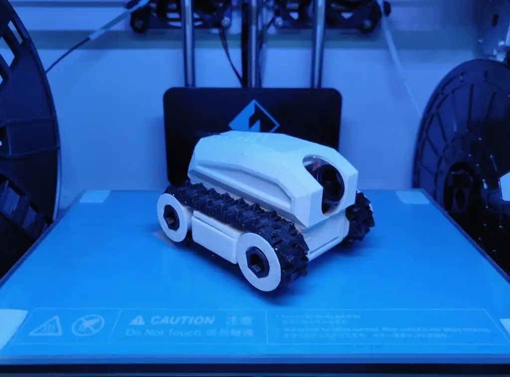 FPV - Tracked Vehicle: 3D Printed Remote-Controlled Mini FPV Tank with Modular Design, ESP32 Control, and Robotic Arm Base