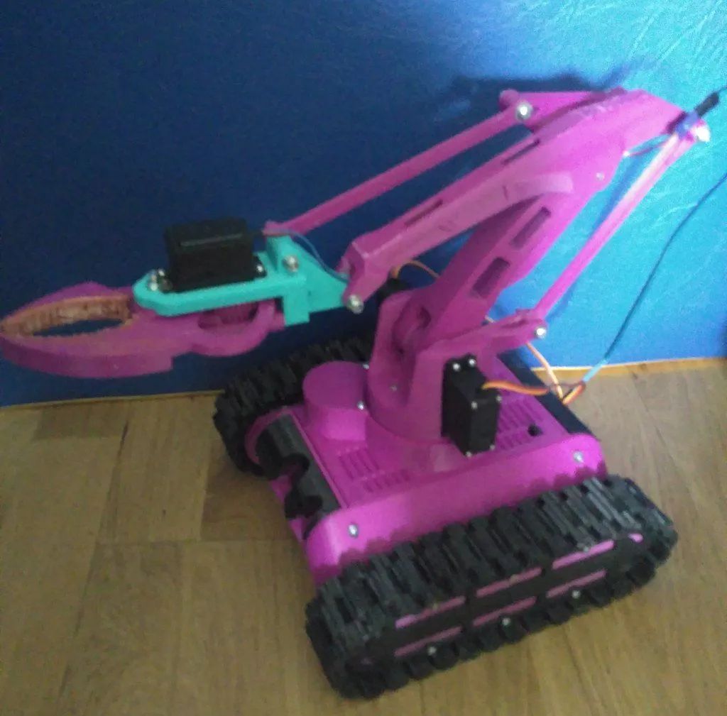 FPV - Tracked Vehicle: 3D Printed Remote-Controlled Mini FPV Tank with Modular Design, ESP32 Control, and Robotic Arm Base