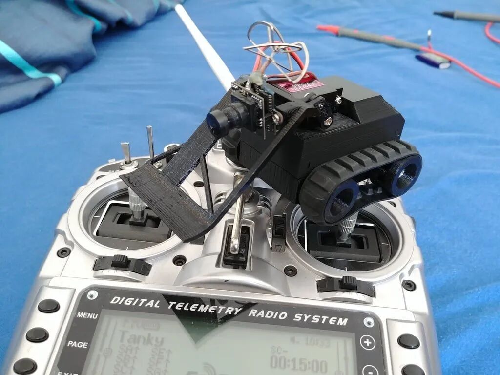 FPV - Tracked Vehicle: 3D Printed Remote-Controlled Mini FPV Tank with Modular Design, ESP32 Control, and Robotic Arm Base