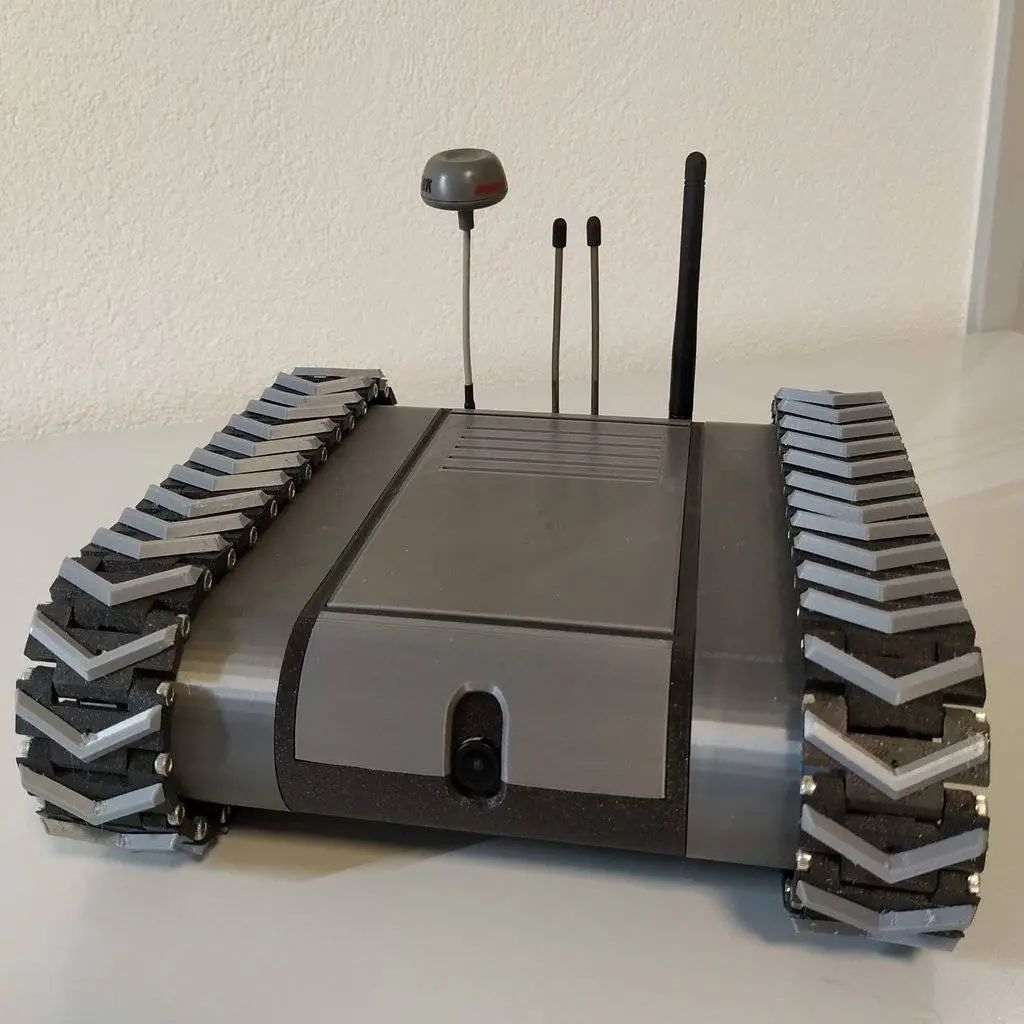 FPV - Tracked Vehicle: 3D Printed Remote-Controlled Mini FPV Tank with Modular Design, ESP32 Control, and Robotic Arm Base