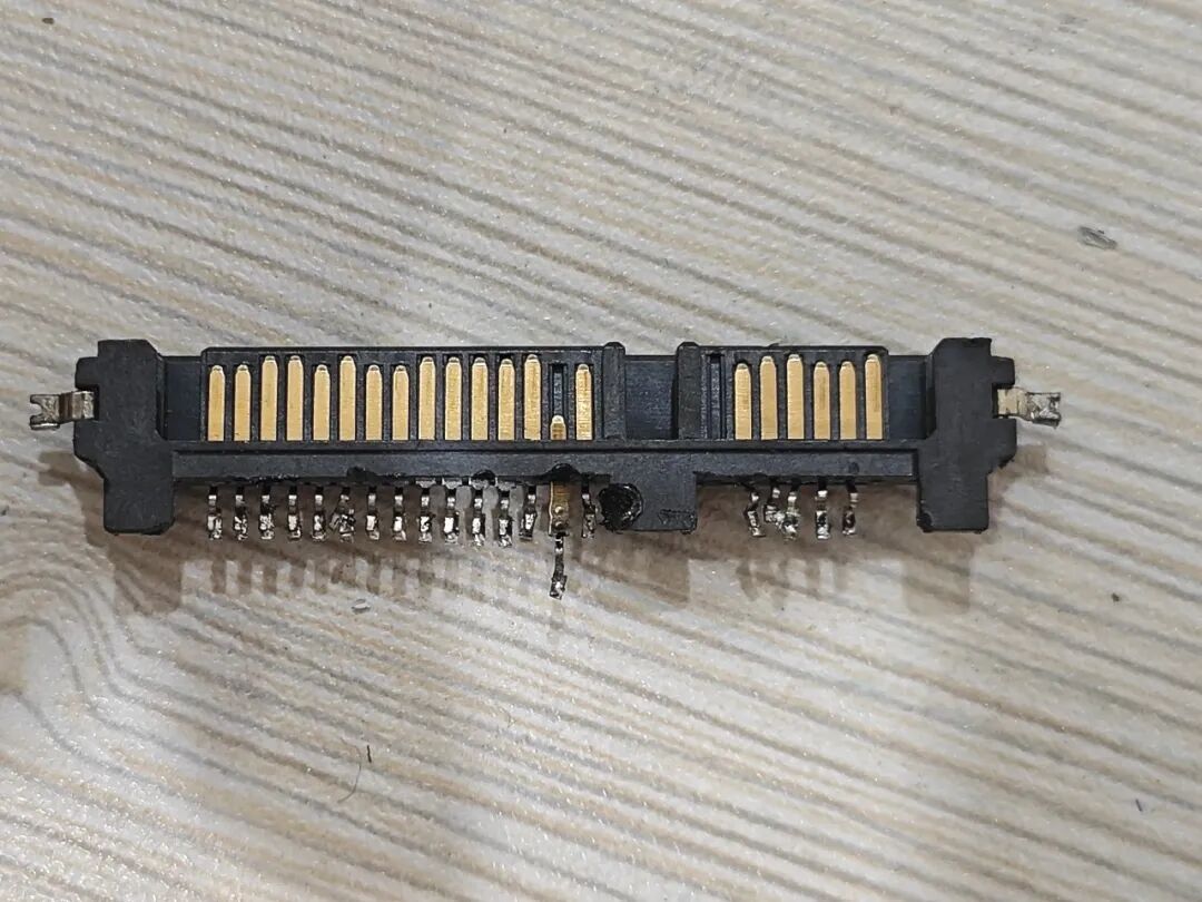 Attempting to Use a Soldering Iron to Disassemble a Circuit Board