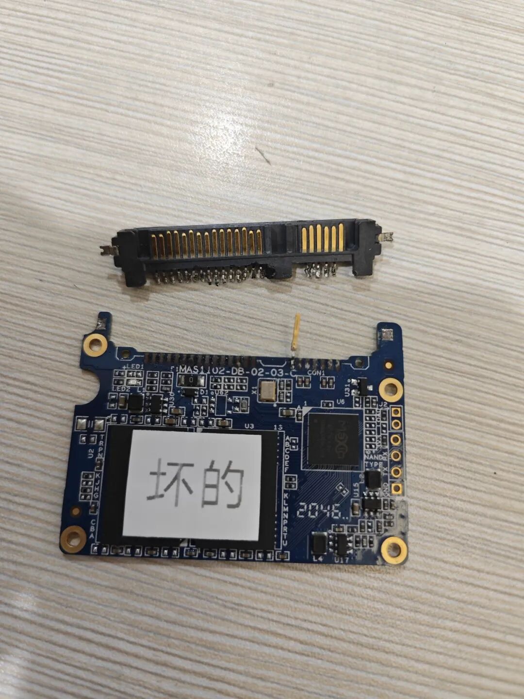 Attempting to Use a Soldering Iron to Disassemble a Circuit Board