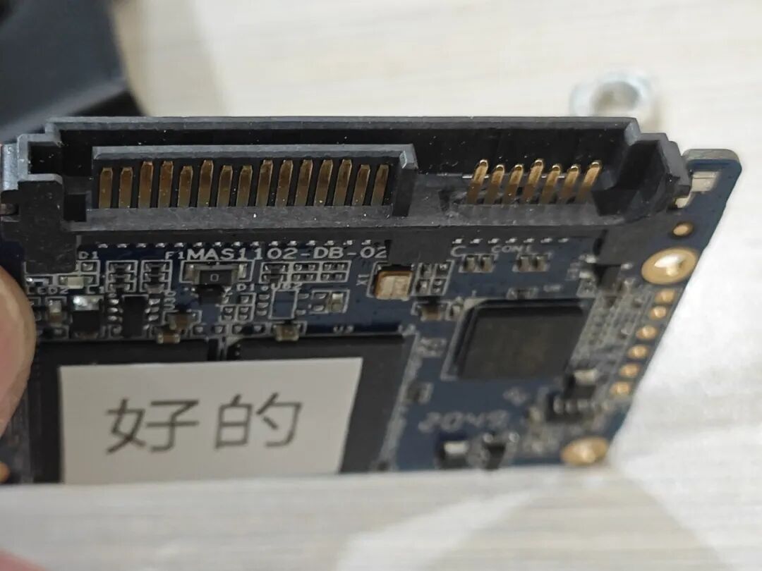 Attempting to Use a Soldering Iron to Disassemble a Circuit Board