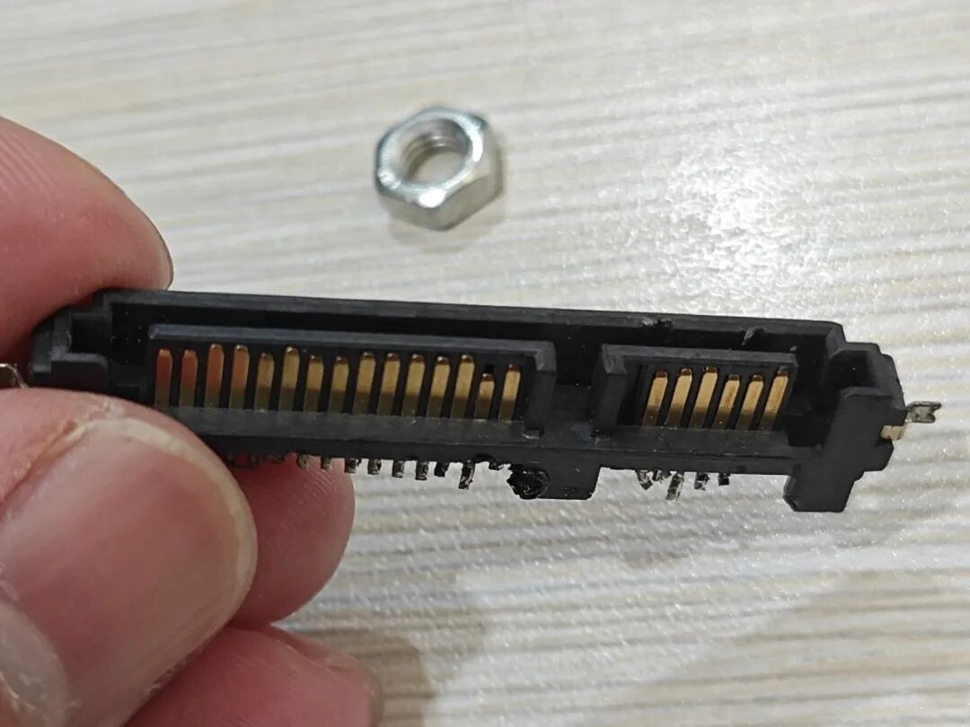 Attempting to Use a Soldering Iron to Disassemble a Circuit Board
