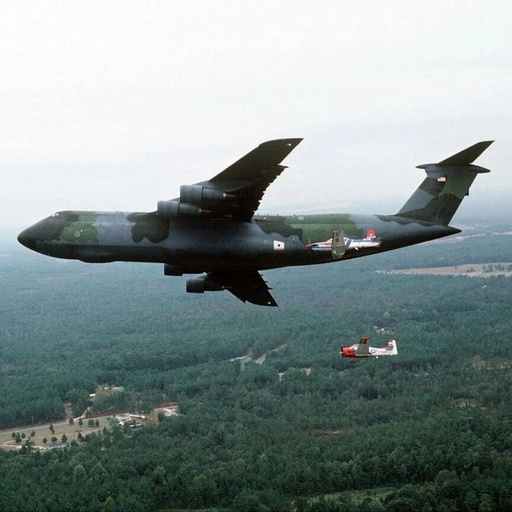 U.S. Air Force C-5 'Galaxy' Transport Aircraft and Trainer Aircraft Formation Flight