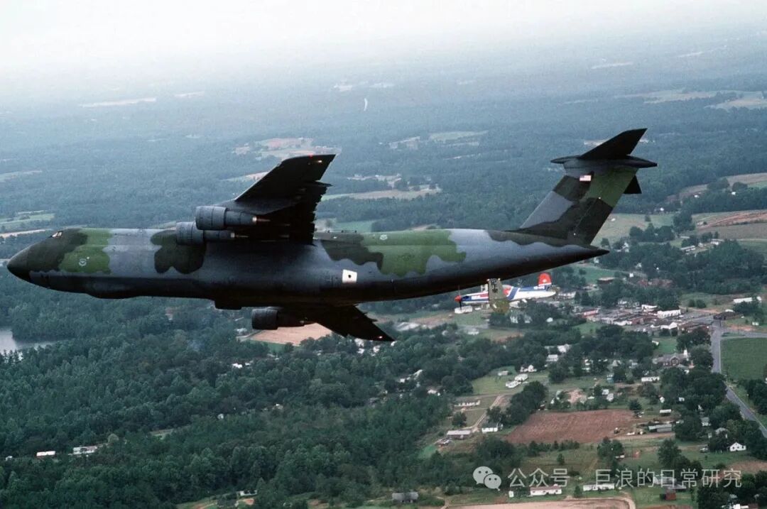 U.S. Air Force C-5 'Galaxy' Transport Aircraft and Trainer Aircraft Formation Flight