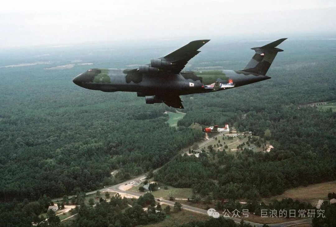 U.S. Air Force C-5 'Galaxy' Transport Aircraft and Trainer Aircraft Formation Flight