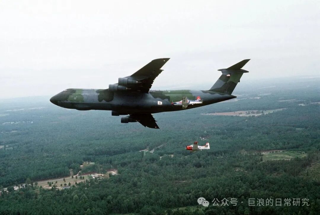 U.S. Air Force C-5 'Galaxy' Transport Aircraft and Trainer Aircraft Formation Flight