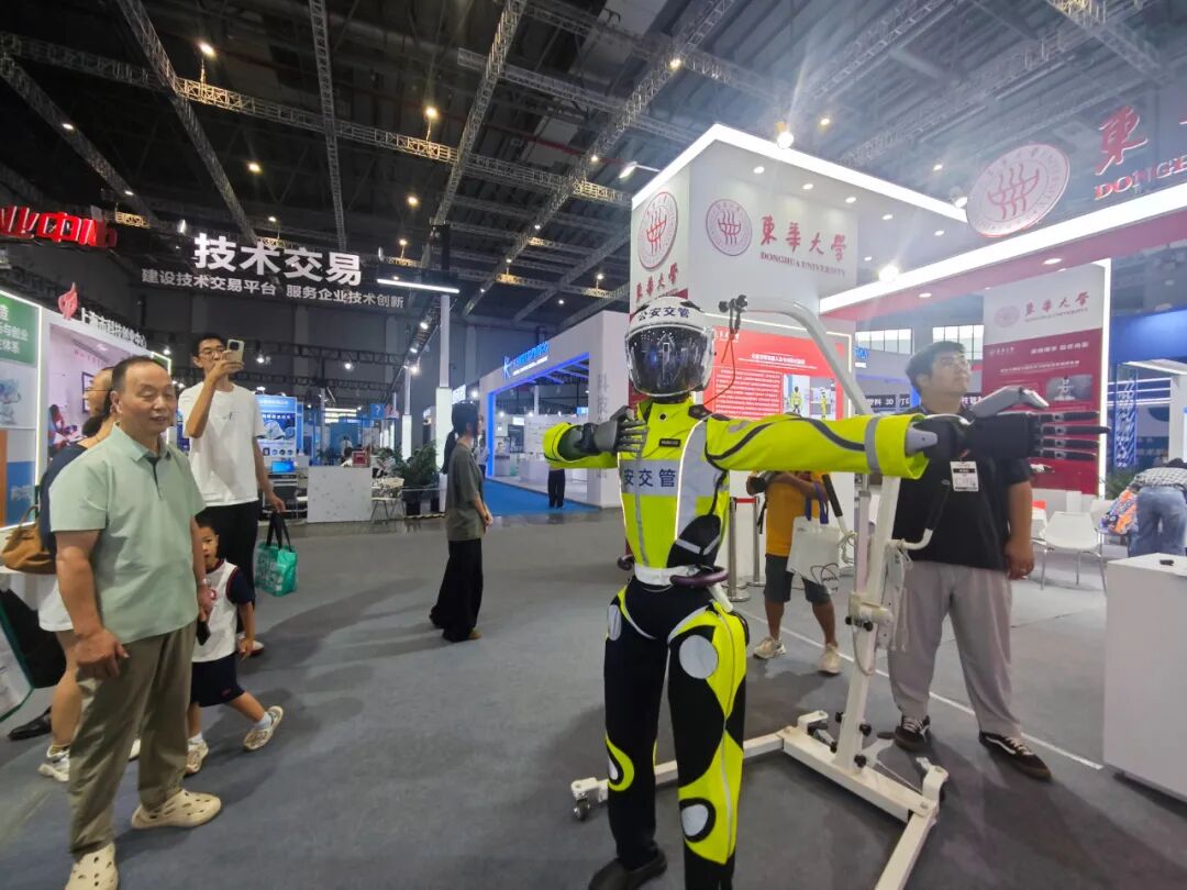 AI Diagnosis, Robot Traffic Control, and Mind-Controlled Wheelchairs: Long Lines at University Booths at the Industrial Expo
